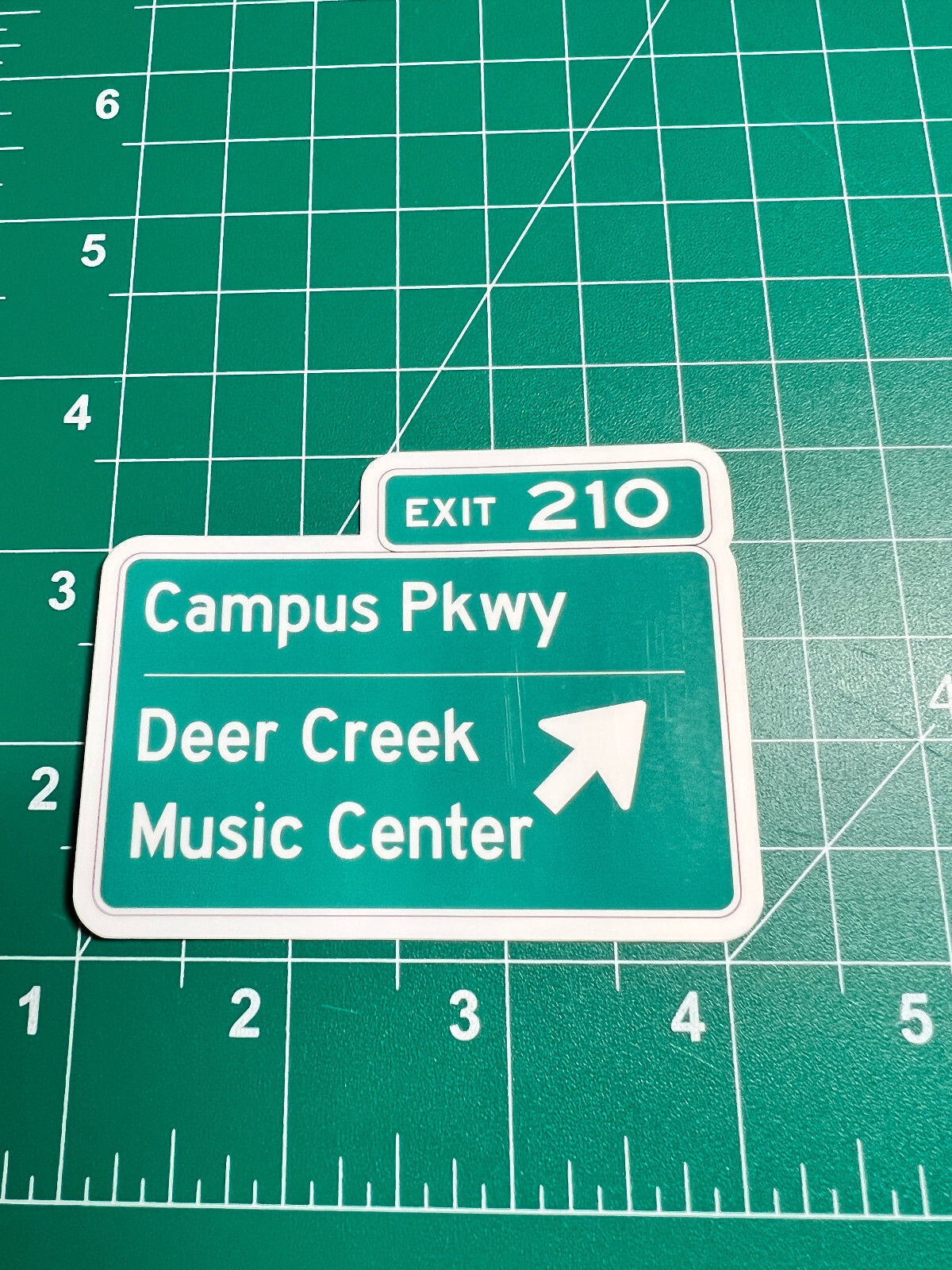 Deer Creek Music Center Road Sign – Laminated Vinyl Sticker – 2.5″x3″