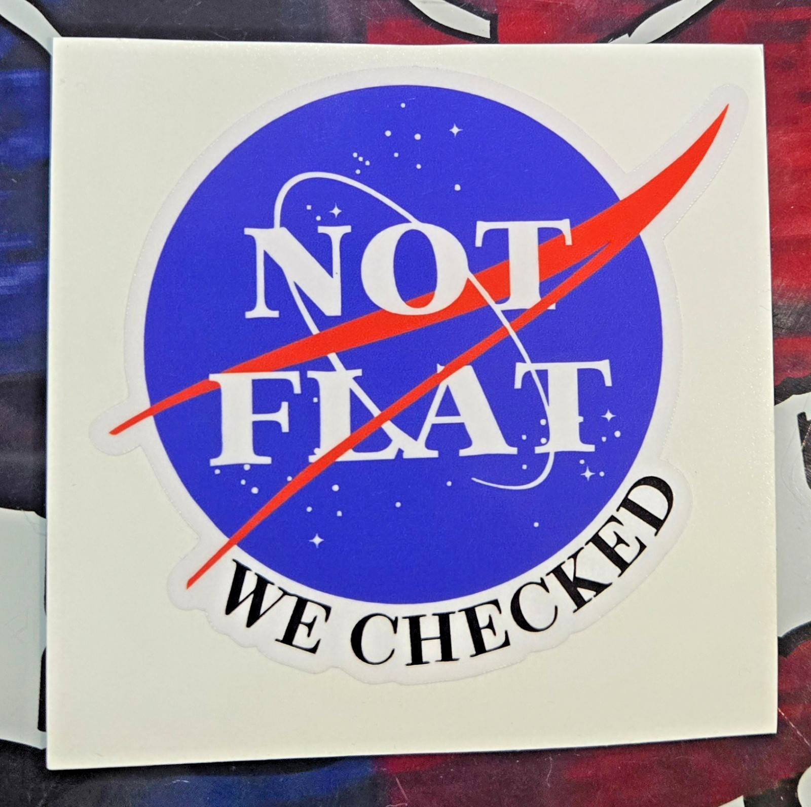 LAMINATED NOT FLAT, WE CHECKED STICKER