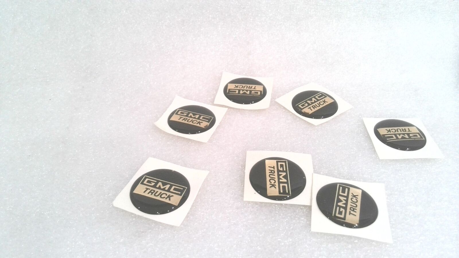 GMC TRUCK DOMED STICKER, BLACK/GOLD, 2 MM X 1.1″ (LOT OF 18)