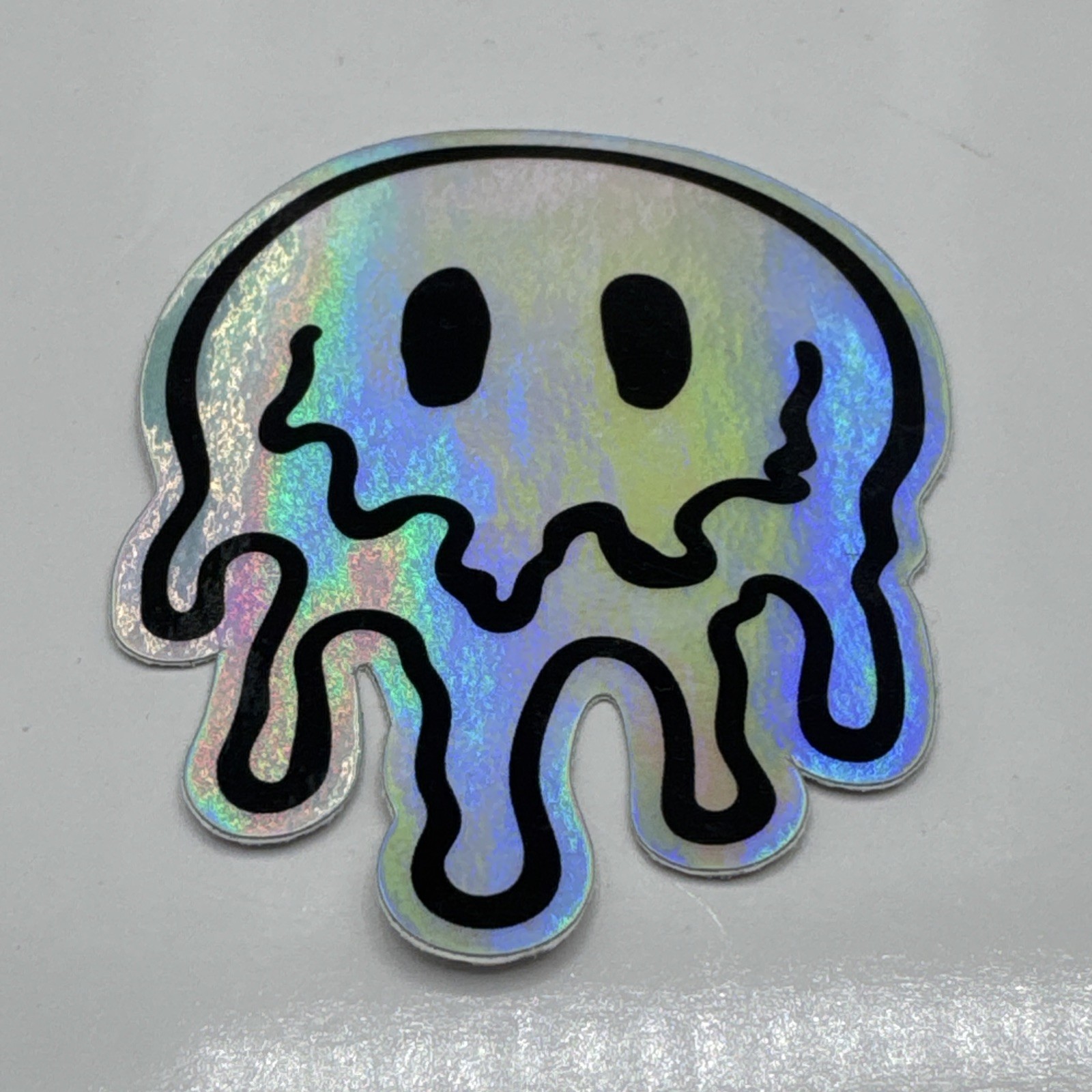Melting Trippy Smiley Face Sticker Glossy Holographic Laminate Accessory 3.5″ In