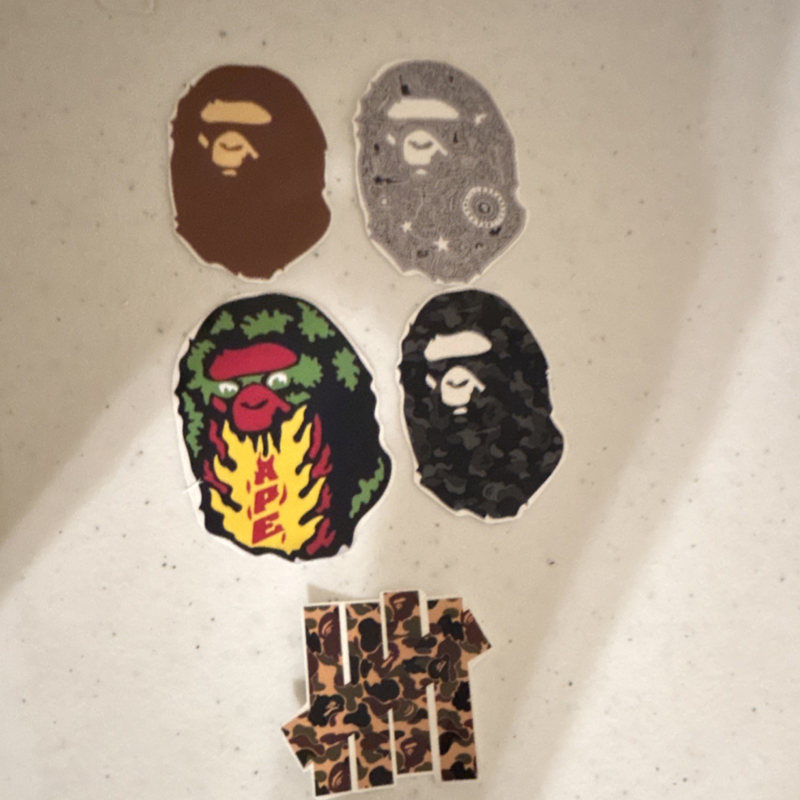 A Bathing Ape Gorilla with undefeatedxBape sticker set
